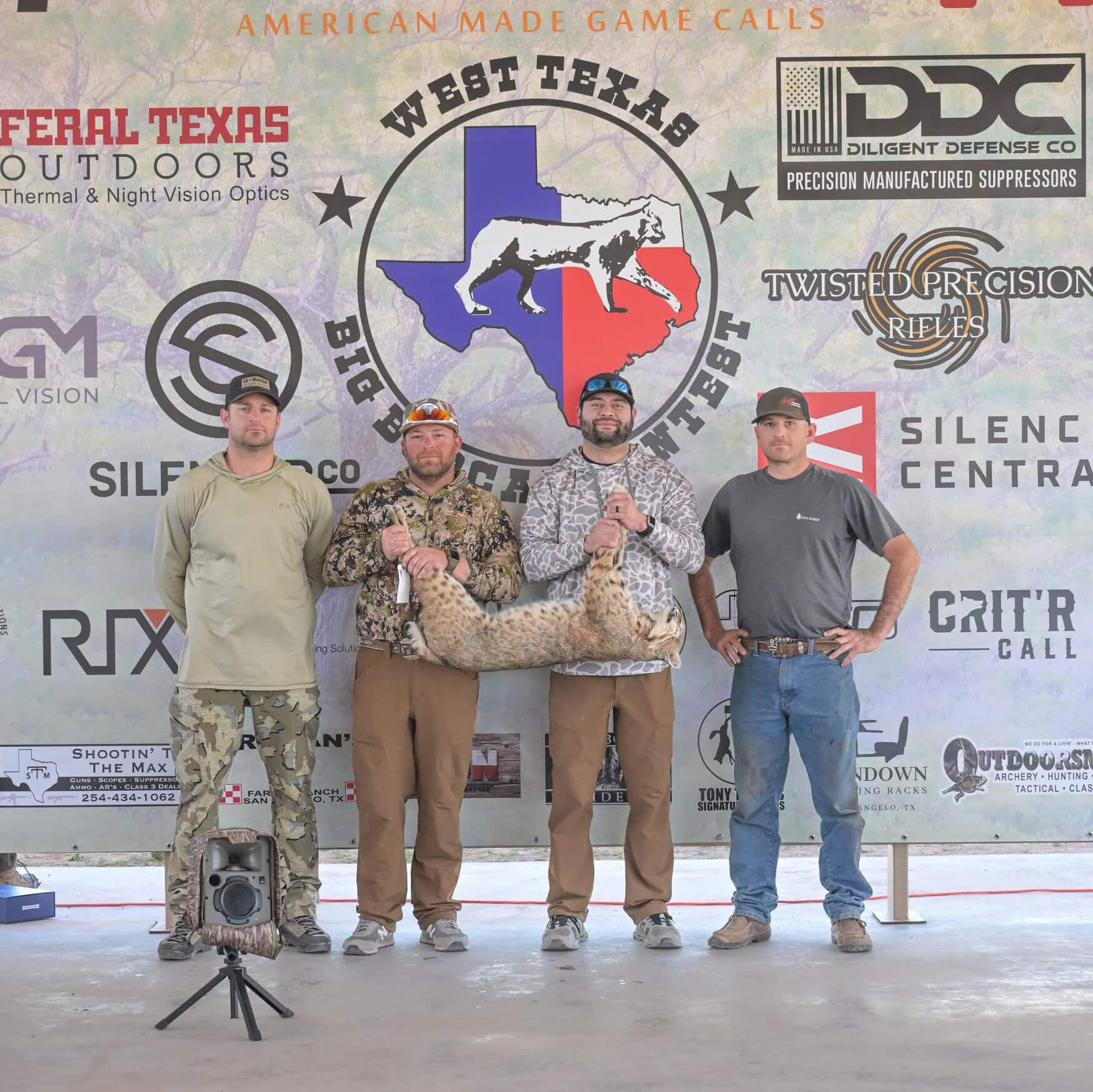 Rick Mitchell II, Blake Cox, Brandon Ramirez and Dillon Shaw with their bobcat at the West Texas Big Bobcat Contest.