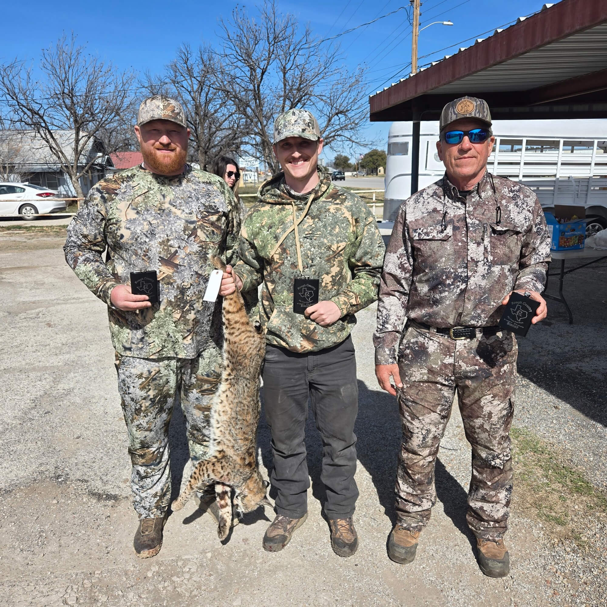 Ken Wimberley and his sons accept a tournament jackpot check at the Rough Country Big Gray Contest, Texas.